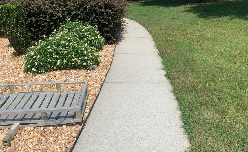 Pressure washing sidewalk after